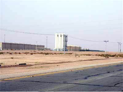 Exterior view of a pumping station in the desert.